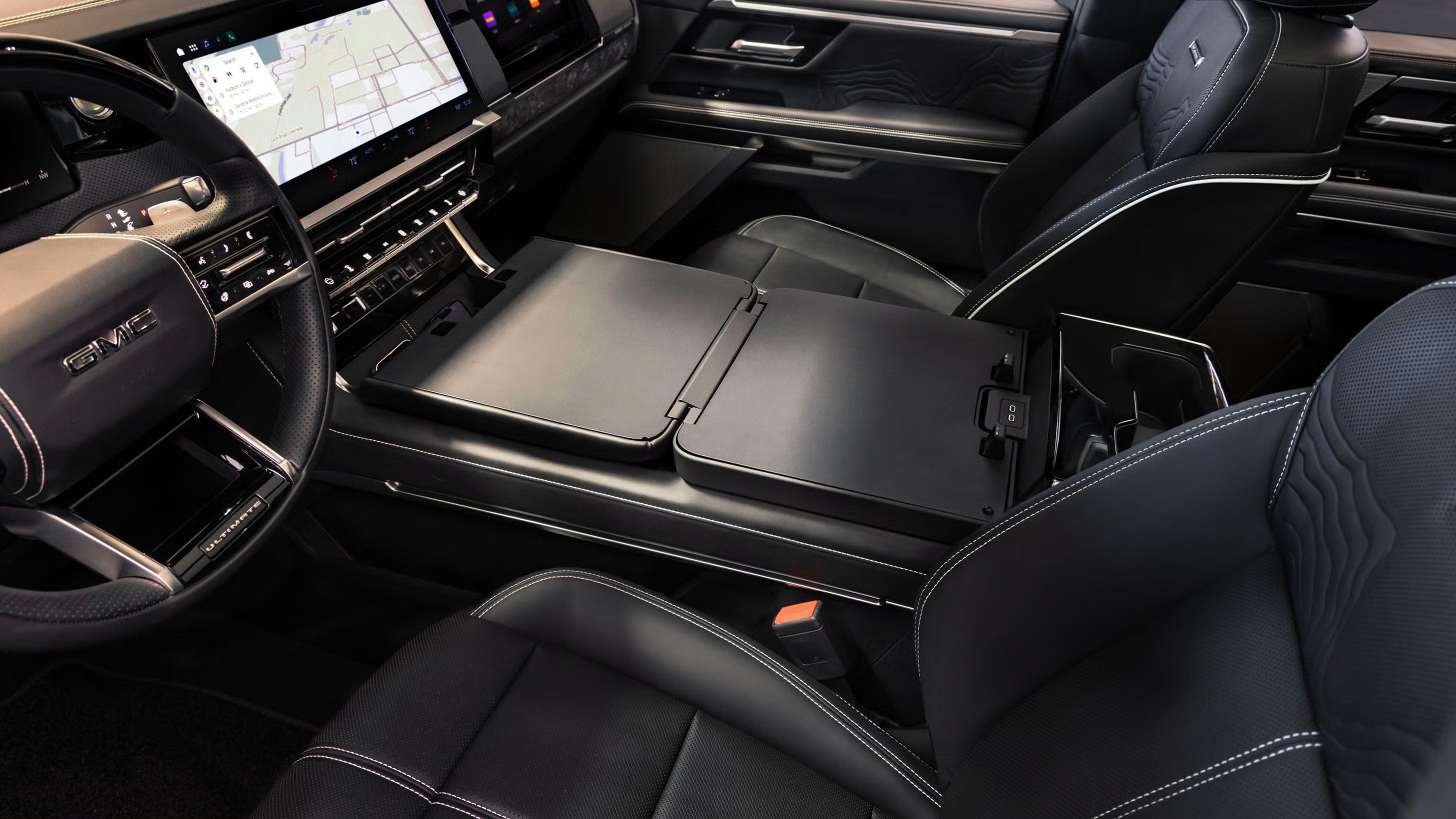 2027 GMC Sierra 1500 MultiPro center console folded flat to work surface