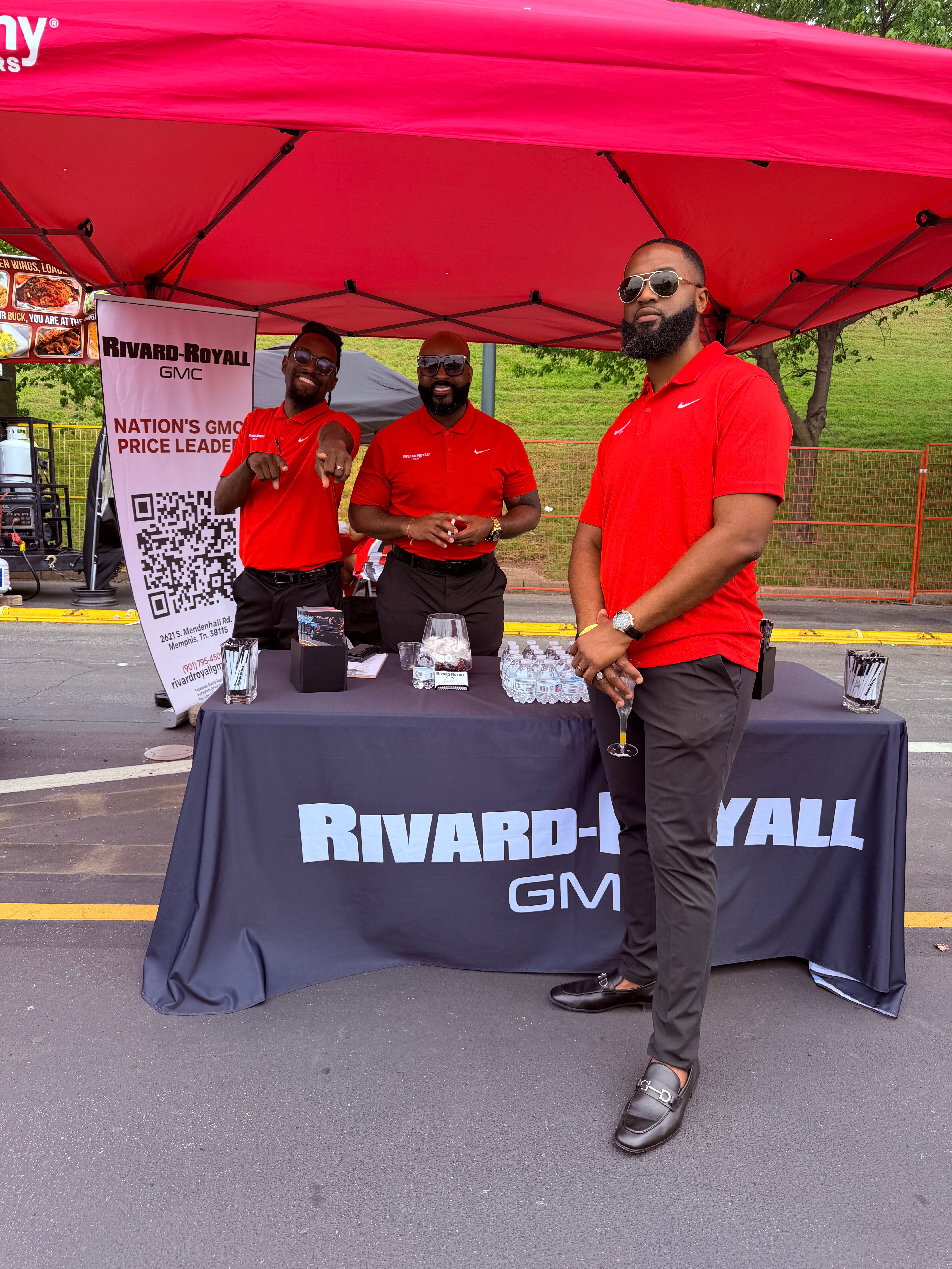 Rivard-Royall GMC team at their branded booth table at the 2026 Mimosa Festival