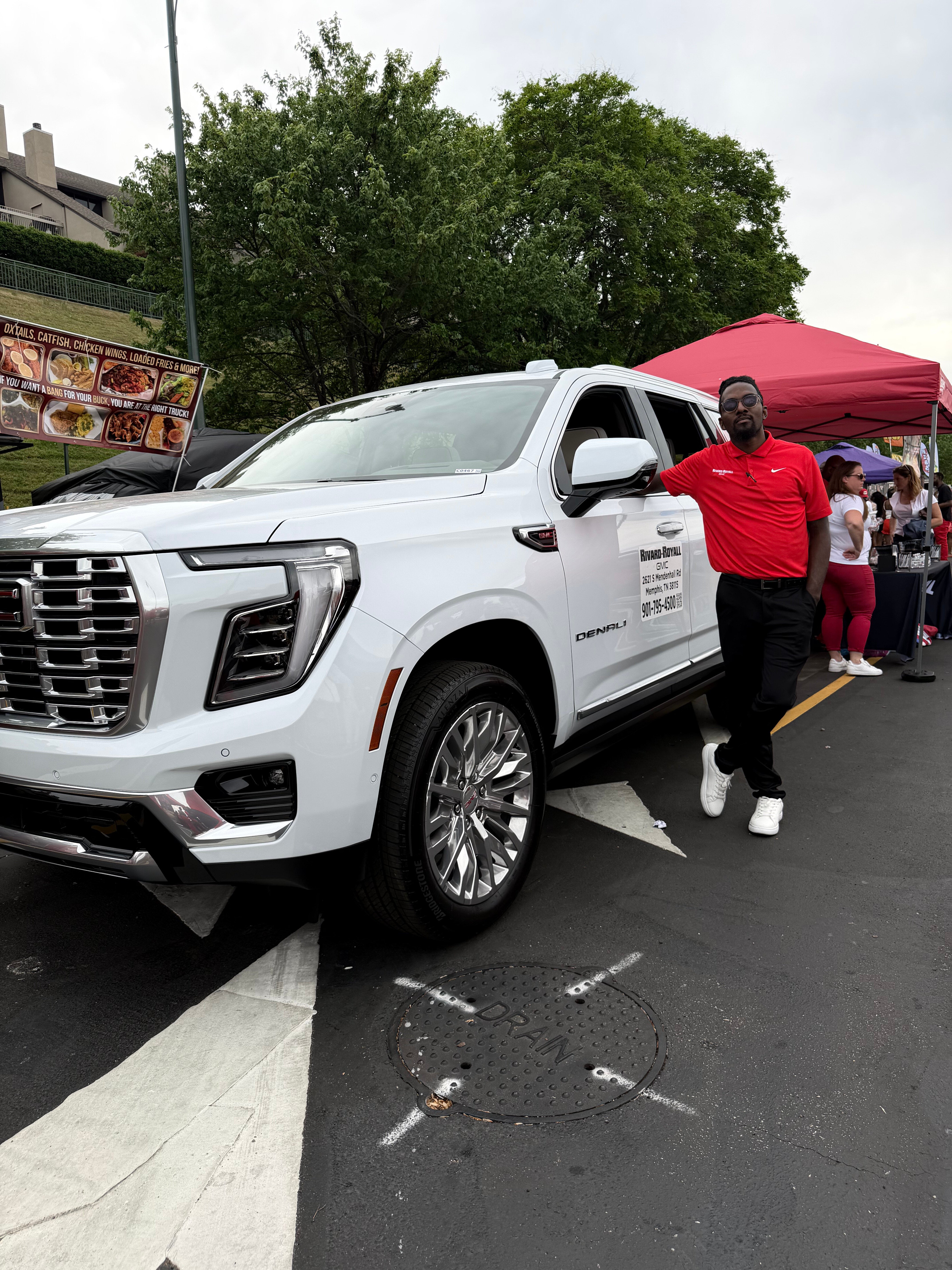Derrick from Rivard-Royall GMC showing off the new GMC Yukon at the 2026 Mimosa Festival